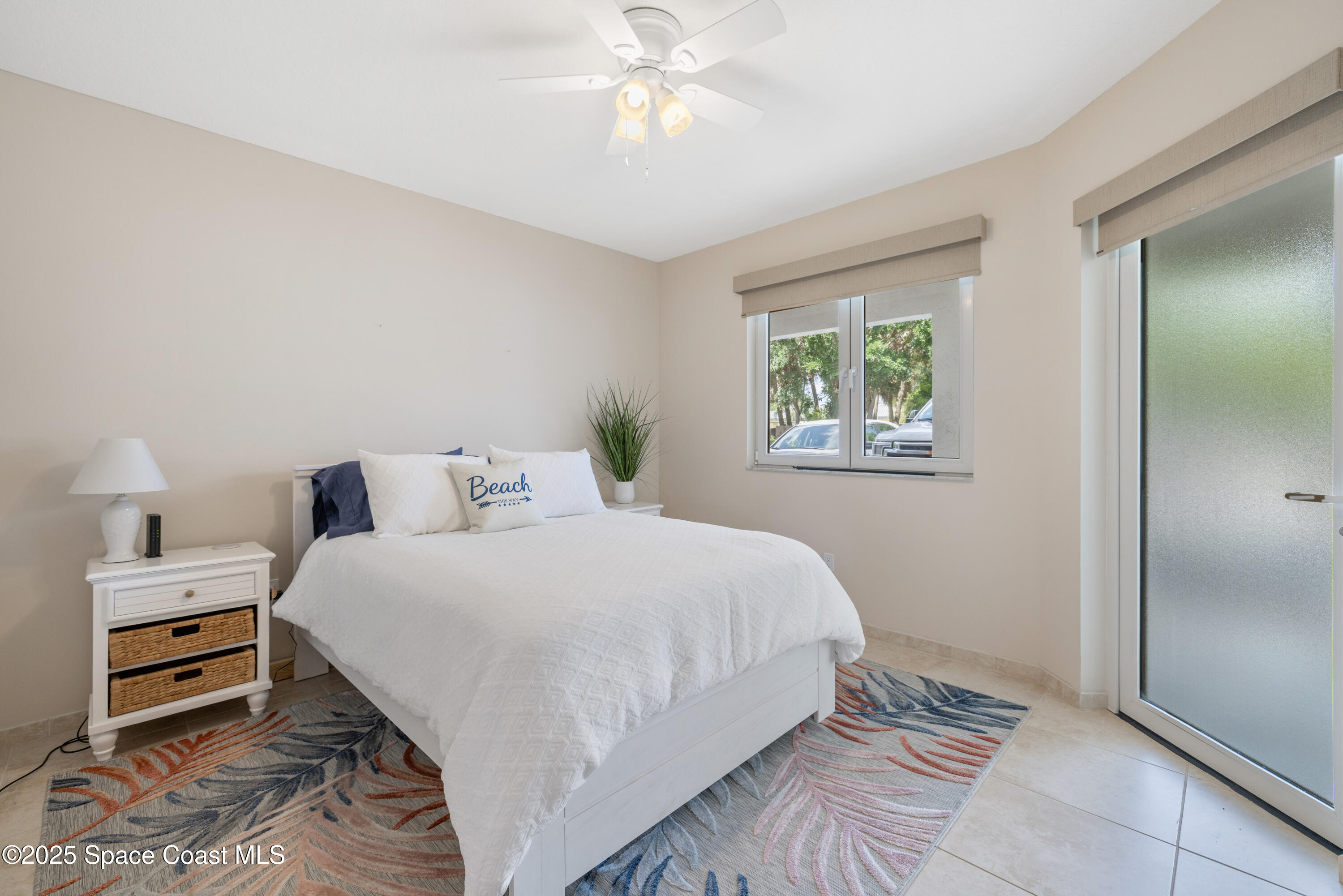 1623 Indian River Drive, Unit 103 Sebastian, FL 32958 - Photo 26 of 36 a bedroom with a bed and a window