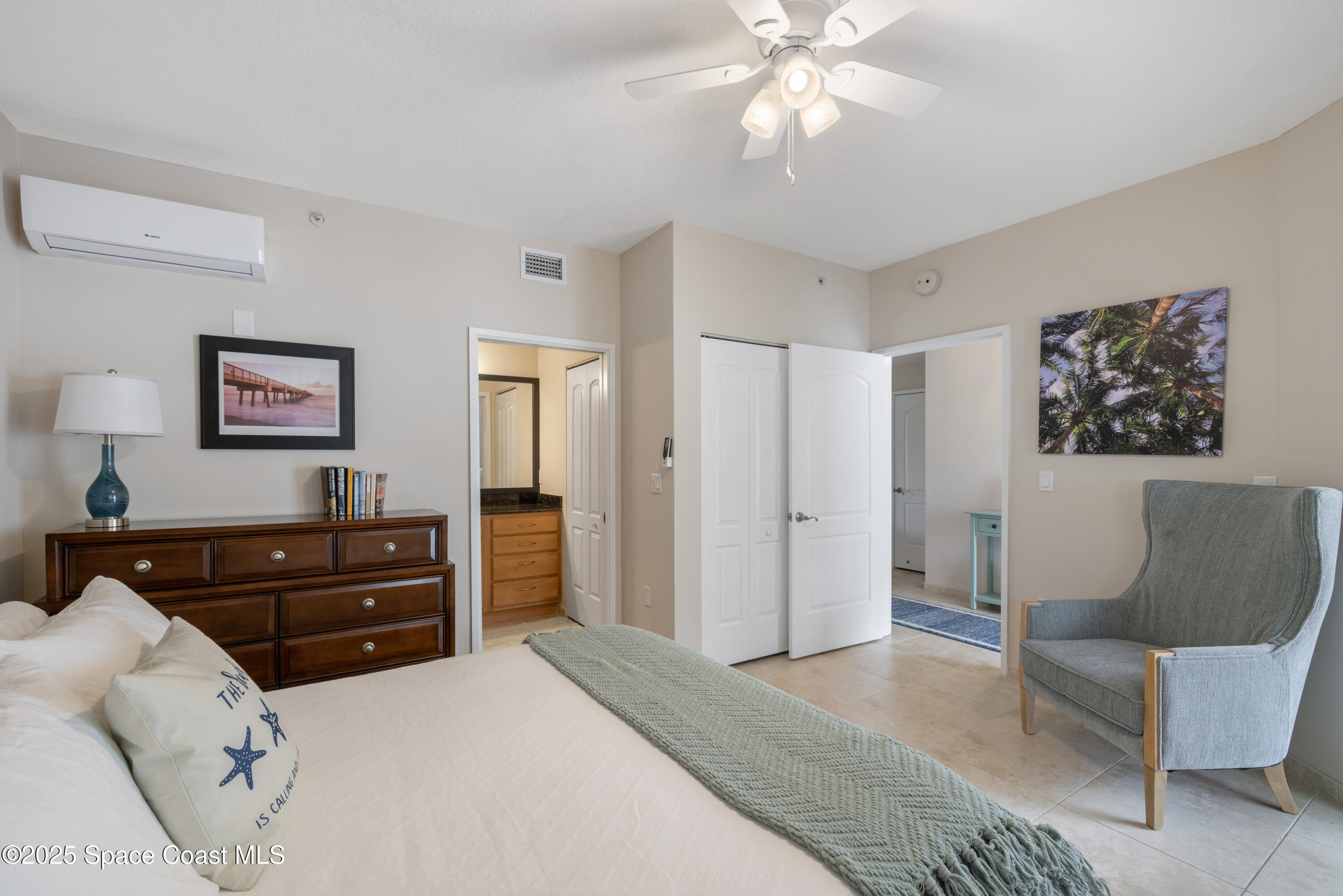 1623 Indian River Drive, Unit 103 Sebastian, FL 32958 - Photo 30 of 36 a bedroom with a bed and a couch