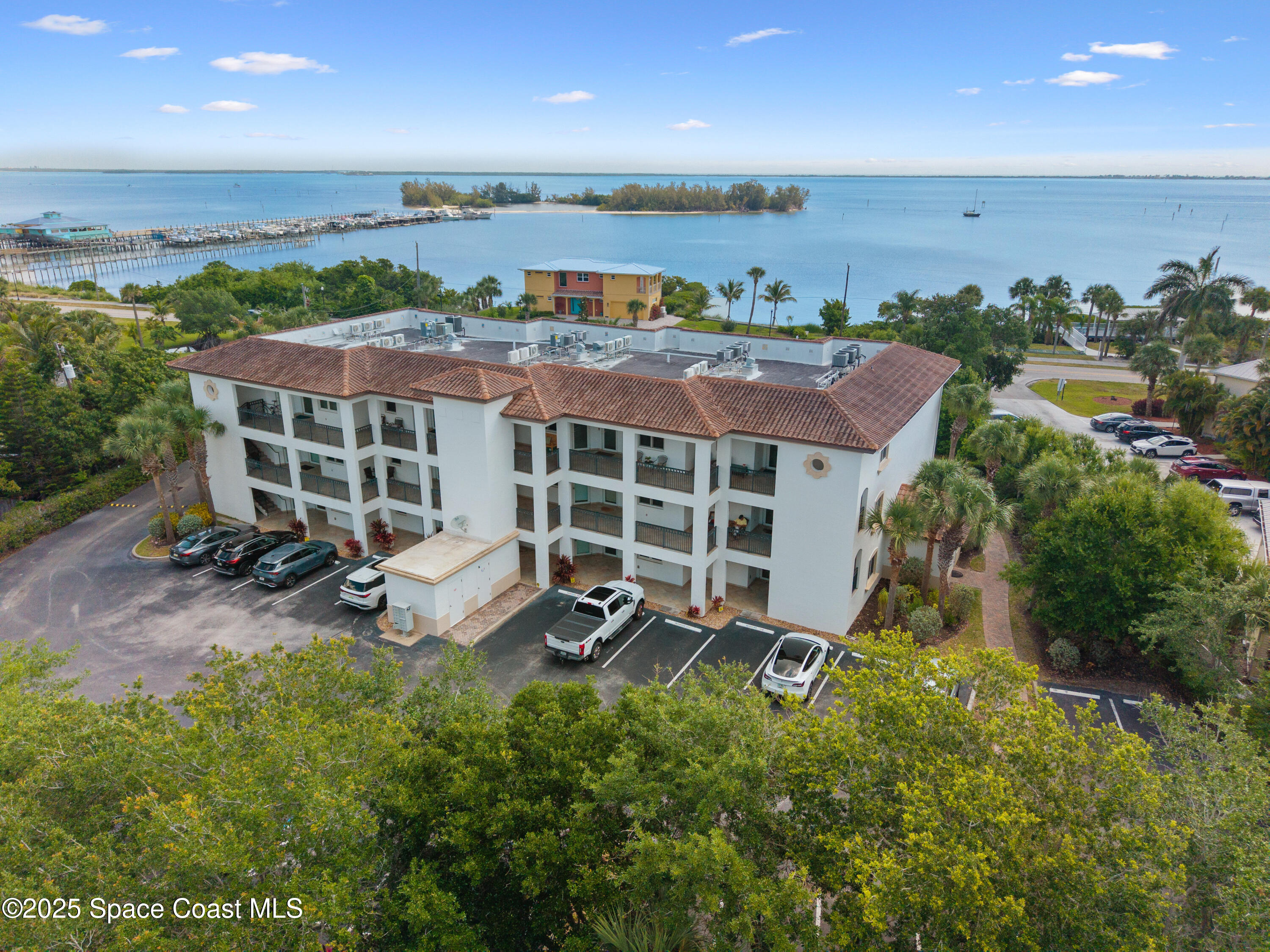 1623 Indian River Drive, Unit 103 Sebastian, FL 32958 - Photo 3 of 36 an aerial view of a house with a garden and outdoor seating