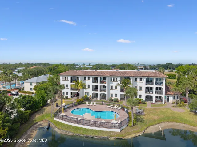 a view of a house with swimming pool and porch