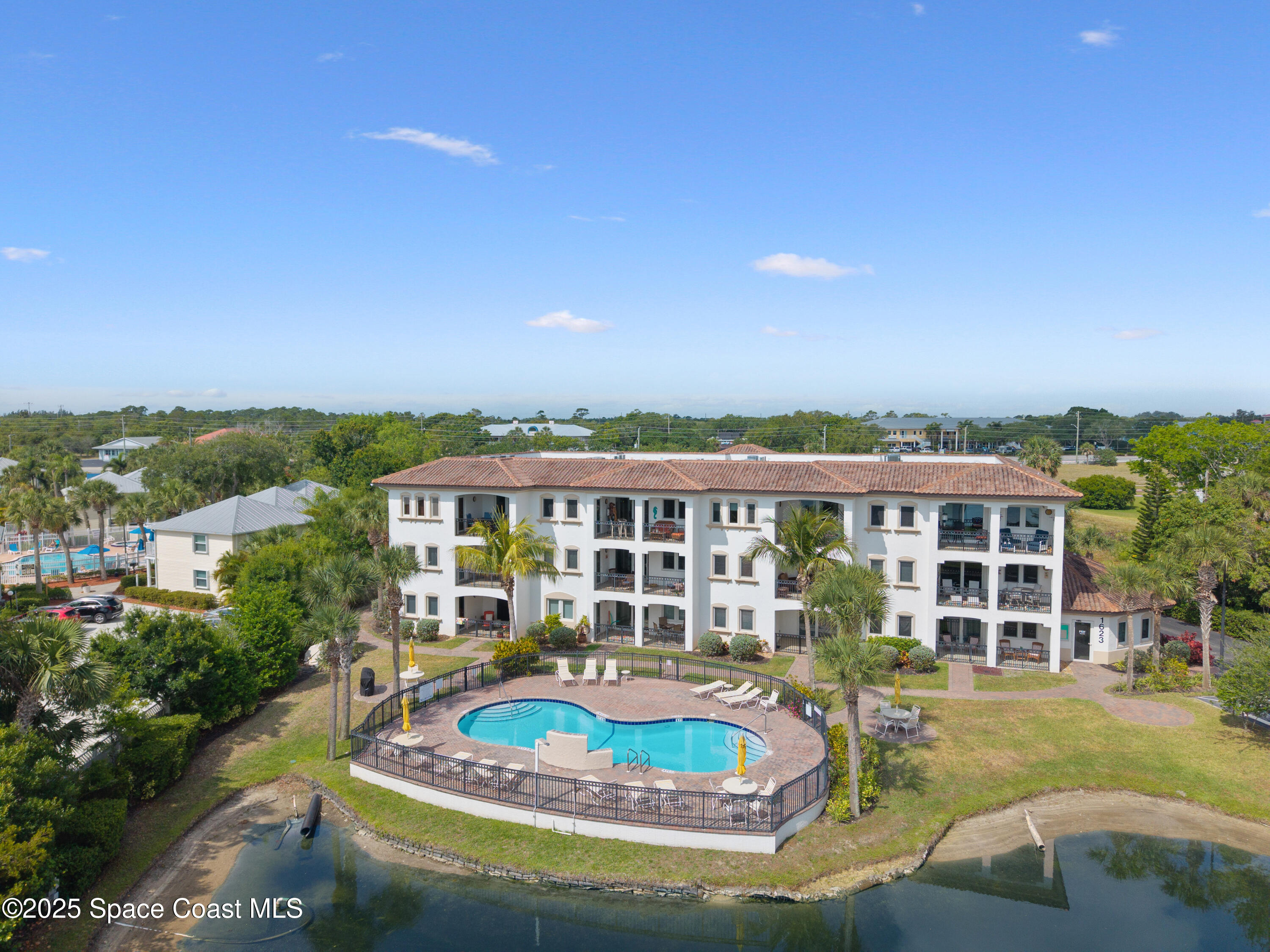 1623 Indian River Drive, Unit 103 Sebastian, FL 32958 - Photo 10 of 36 a view of a house with swimming pool and porch