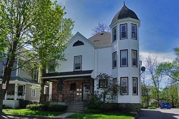 145 Brown Street, Unit 2R Waltham, MA 02453 - Photo 1 of 5 a front view of a house with garden