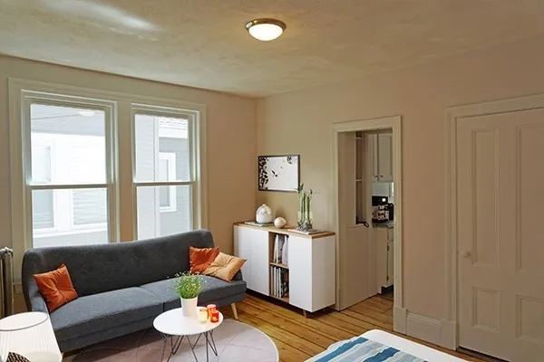 a living room with furniture and a window