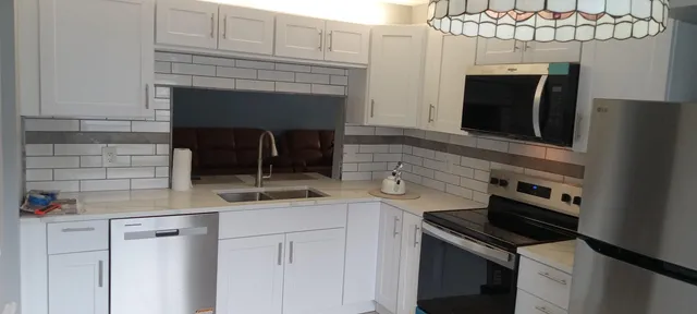 a kitchen with a stove and a microwave