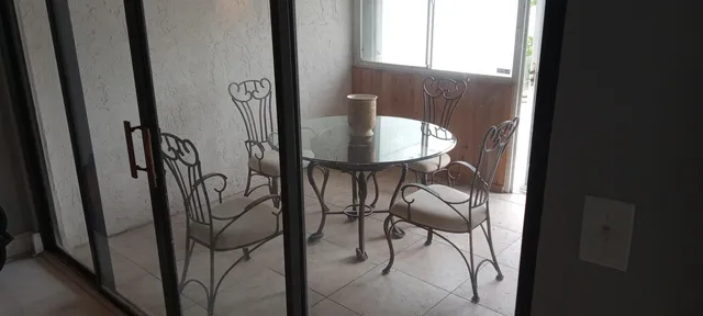 a view of a livingroom with furniture and stairs