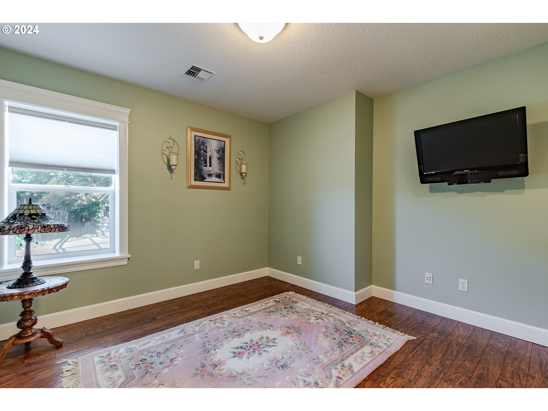 6188 Fernhill Loop Springfield, OR 97478 - Photo 21 of 40 a view of an empty room with a flat screen tv