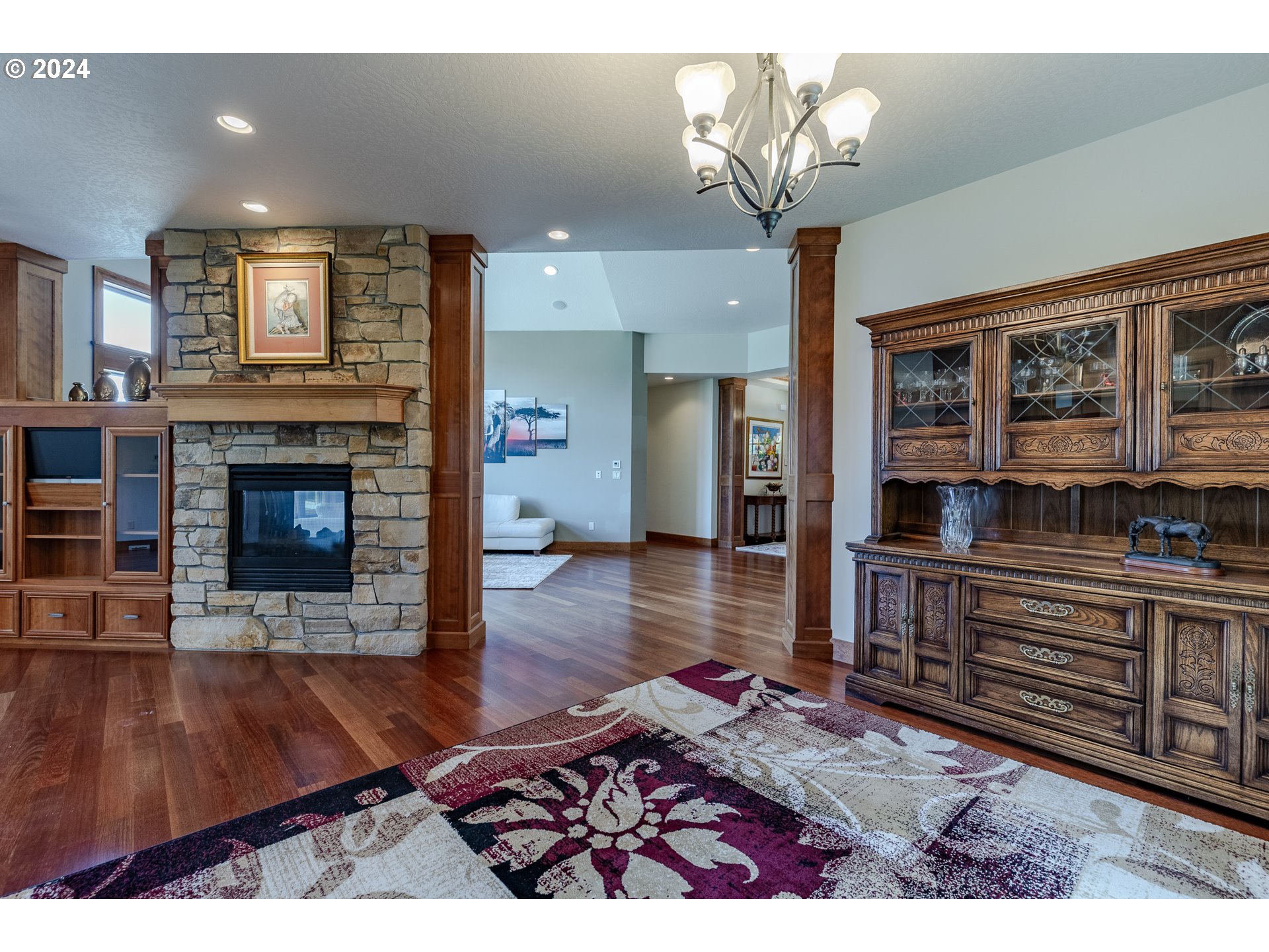 6188 Fernhill Loop Springfield, OR 97478 - Photo 10 of 40 a living room with furniture wooden floor and a fireplace