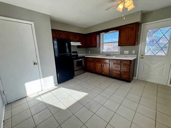 a kitchen with stainless steel appliances a refrigerator and sink