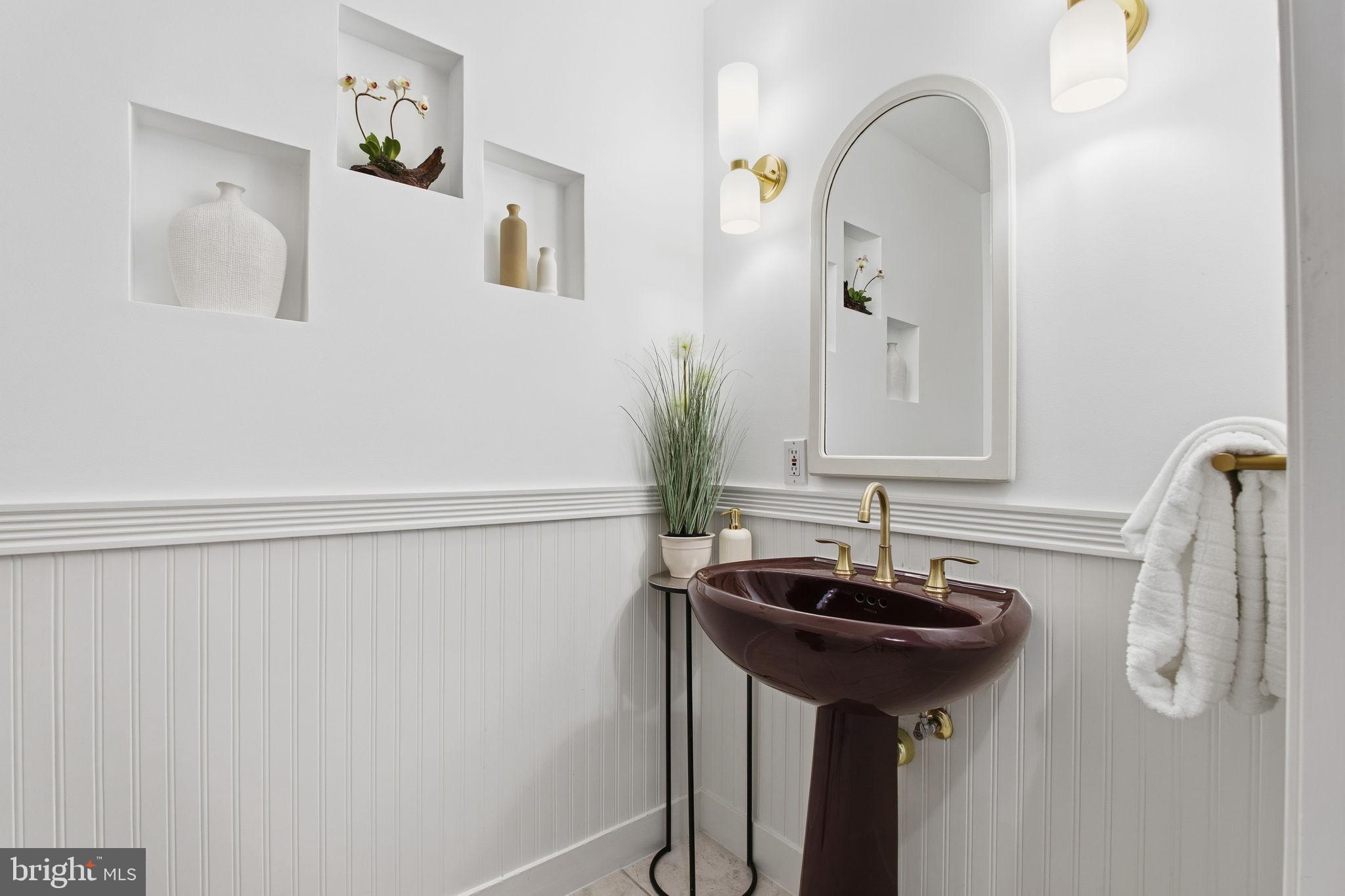 922 Old County Road Severna Park, MD 21146 - Photo 22 of 61 a bathroom with a sink and a mirror
