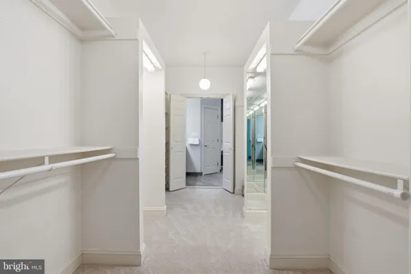 a bathroom with a bathtub double sink and large mirror