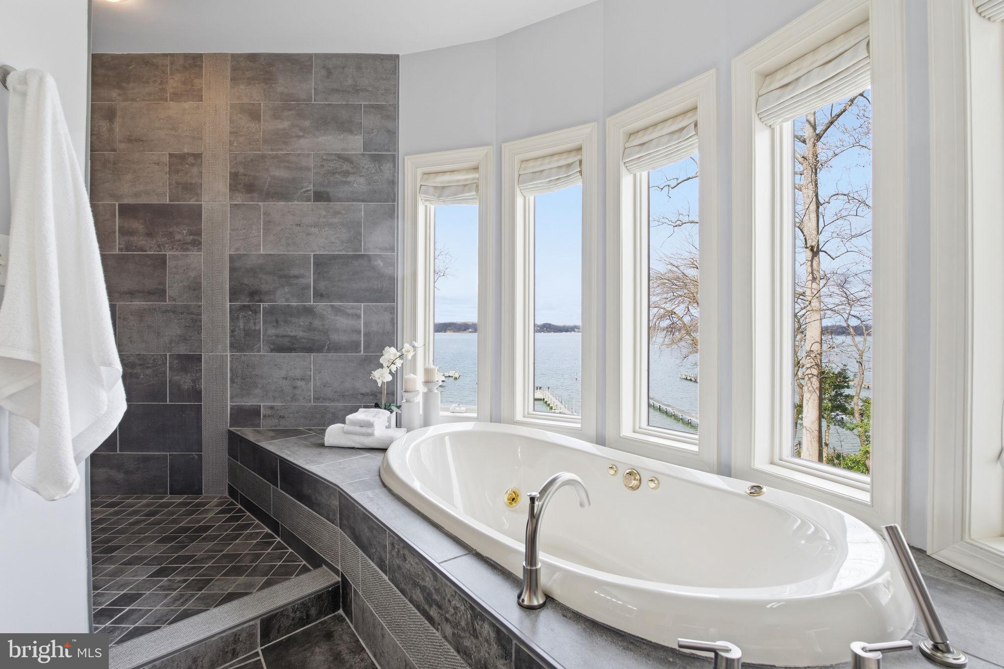 922 Old County Road Severna Park, MD 21146 - Photo 27 of 61 a bathroom with a tub and a sink