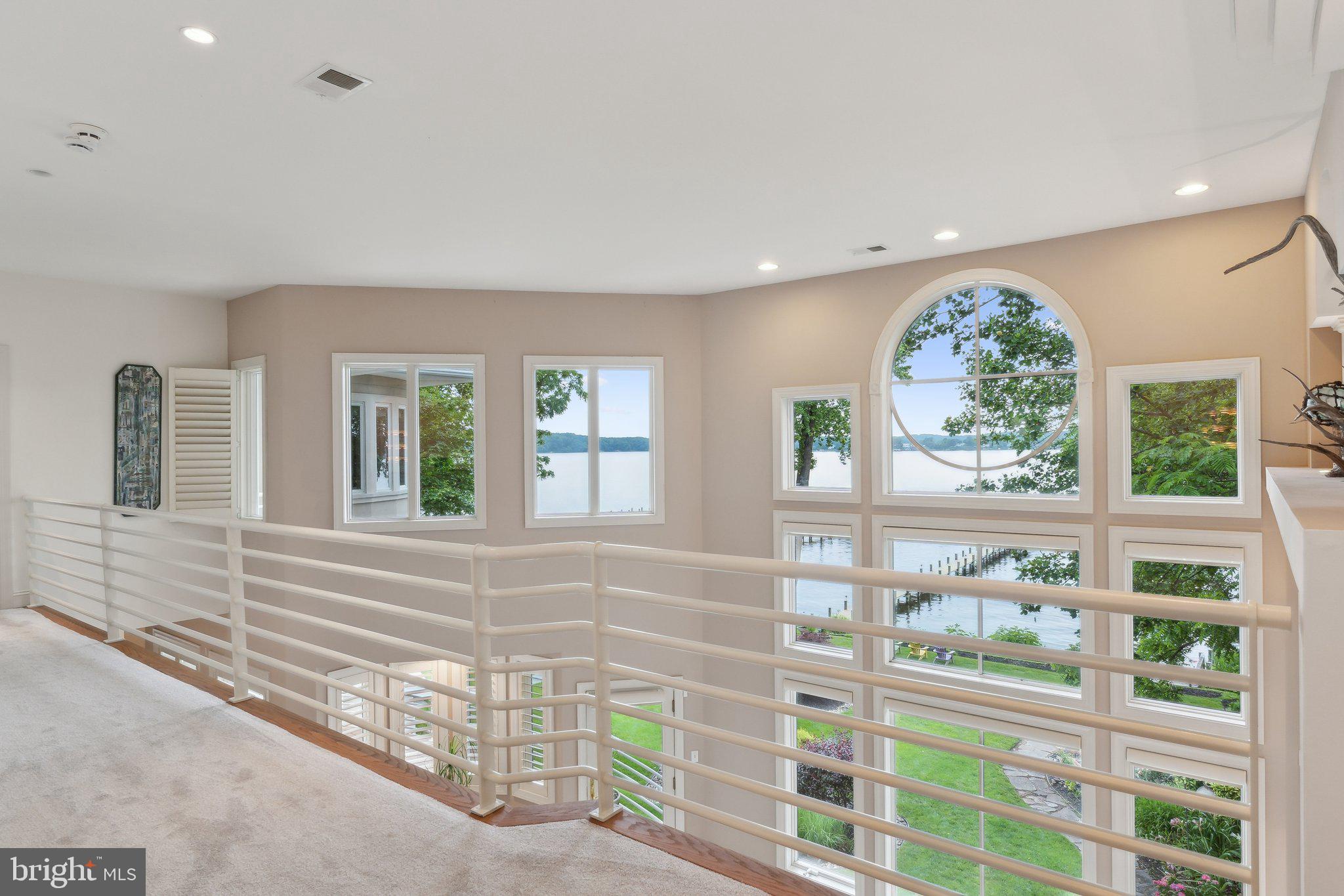922 Old County Road Severna Park, MD 21146 - Photo 39 of 61 a view of a porch with a floor to ceiling window and wooden floor