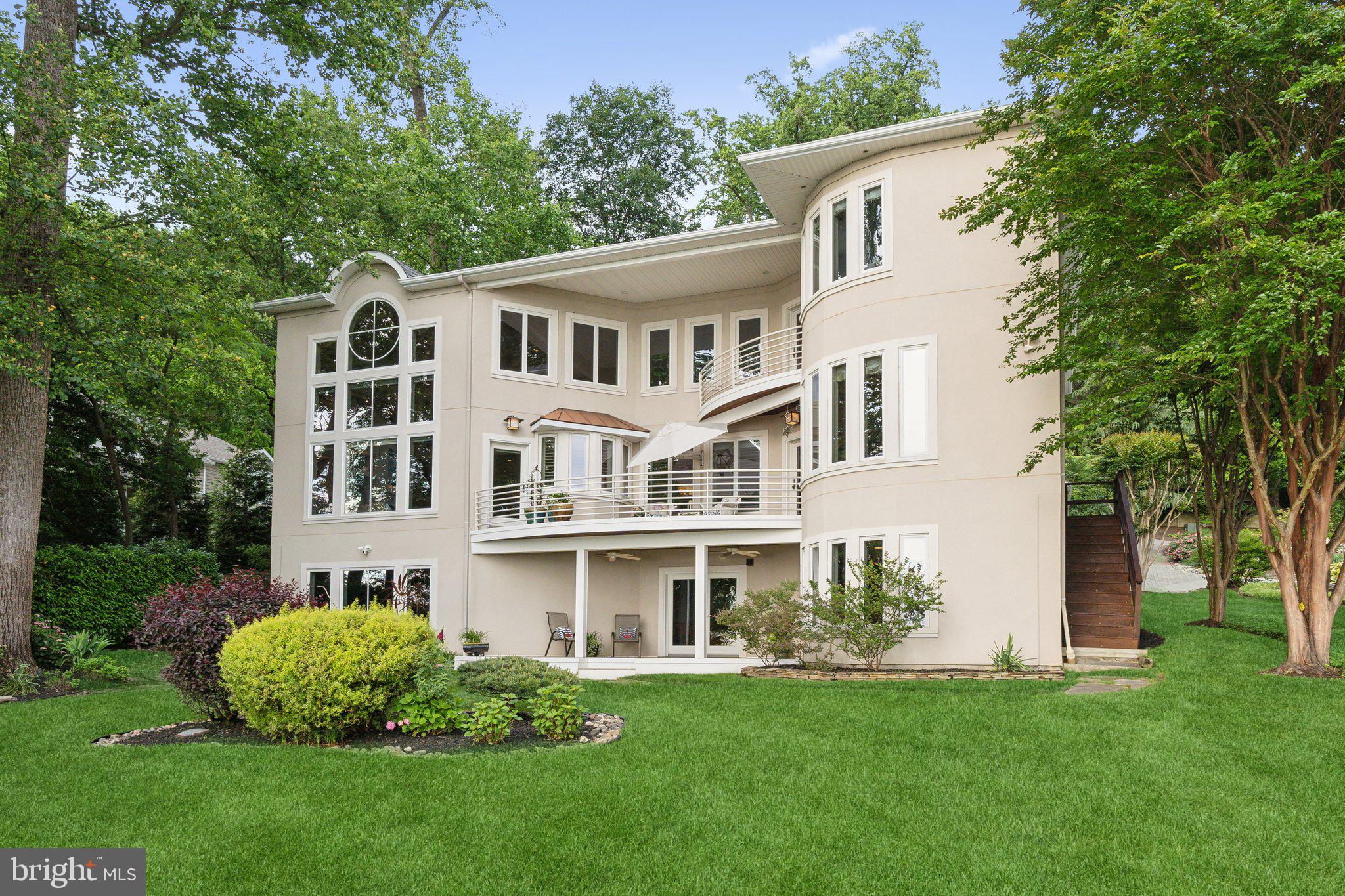 922 Old County Road Severna Park, MD 21146 - Photo 4 of 61 a front view of a house with a garden and plants