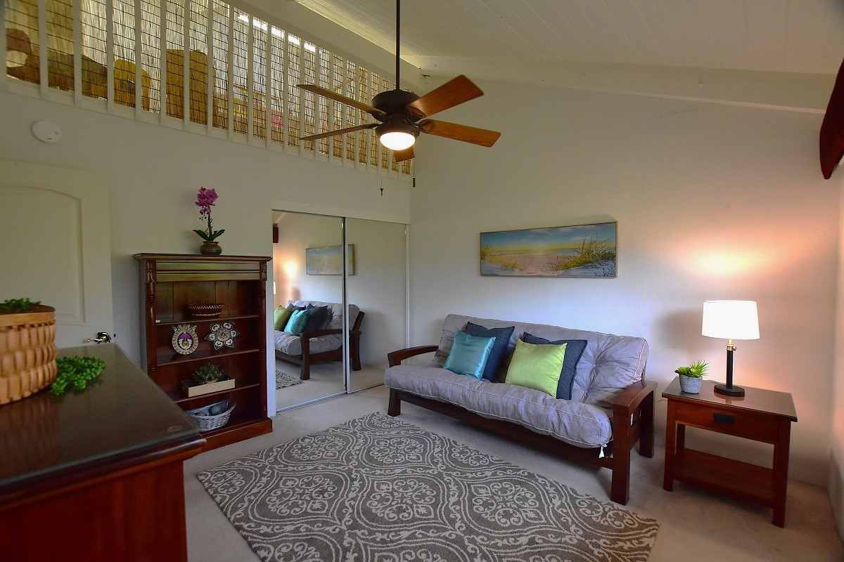 68-3840 Lua Kula Street, Unit D203 Waikoloa, HI 96738 - Photo 12 of 30 a living room with furniture and a fireplace