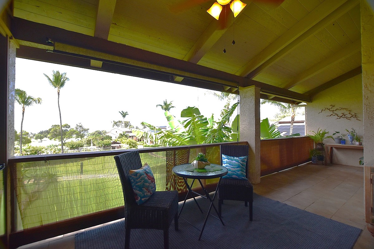 68-3840 Lua Kula Street, Unit D203 Waikoloa, HI 96738 - Photo 14 of 30 a view of a chairs and table in patio next to a yard