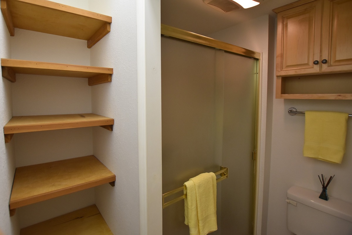 68-3840 Lua Kula Street, Unit D203 Waikoloa, HI 96738 - Photo 18 of 30 a bathroom with a toilet and a sink