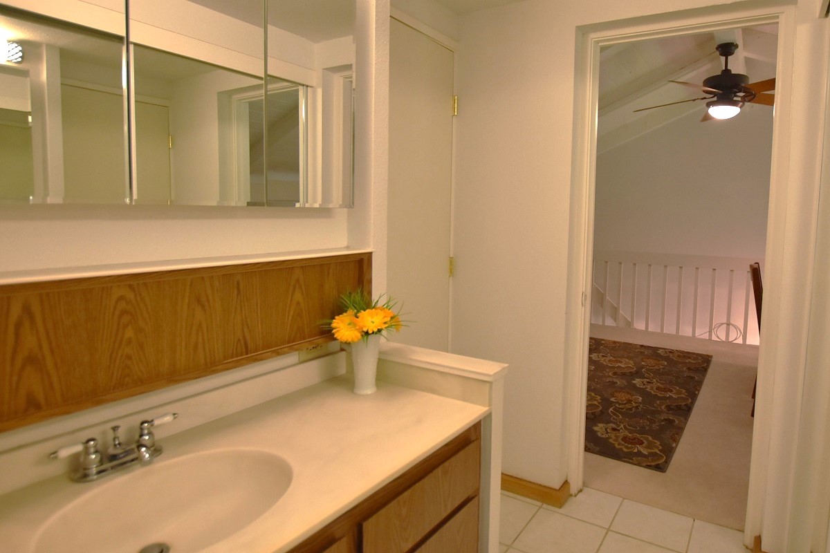 68-3840 Lua Kula Street, Unit D203 Waikoloa, HI 96738 - Photo 19 of 30 a bathroom with a sink toilet and shower