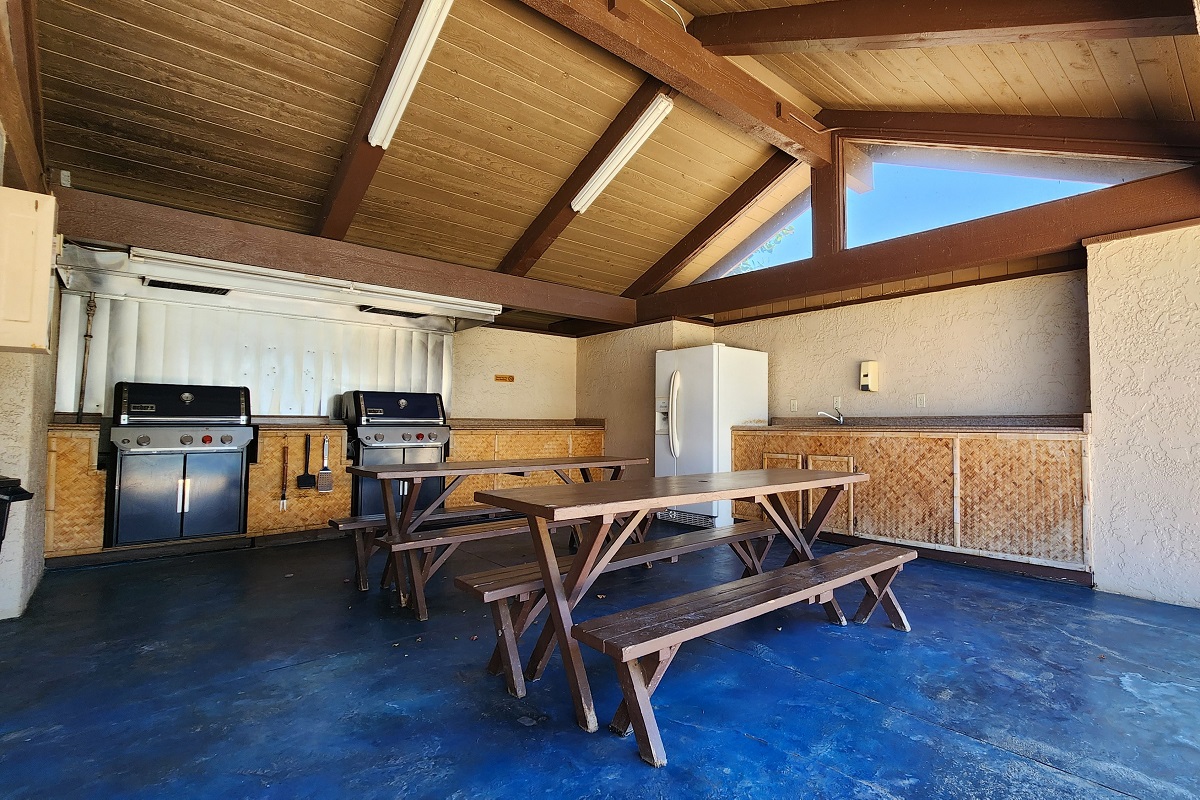 68-3840 Lua Kula Street, Unit D203 Waikoloa, HI 96738 - Photo 22 of 30 a view of a kitchen with furniture and wooden floor