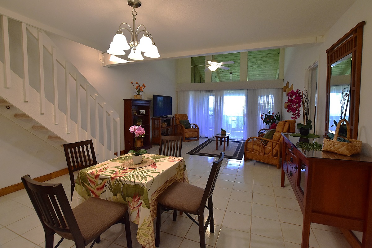 68-3840 Lua Kula Street, Unit D203 Waikoloa, HI 96738 - Photo 3 of 30 a view of a dining room with furniture and chandelier