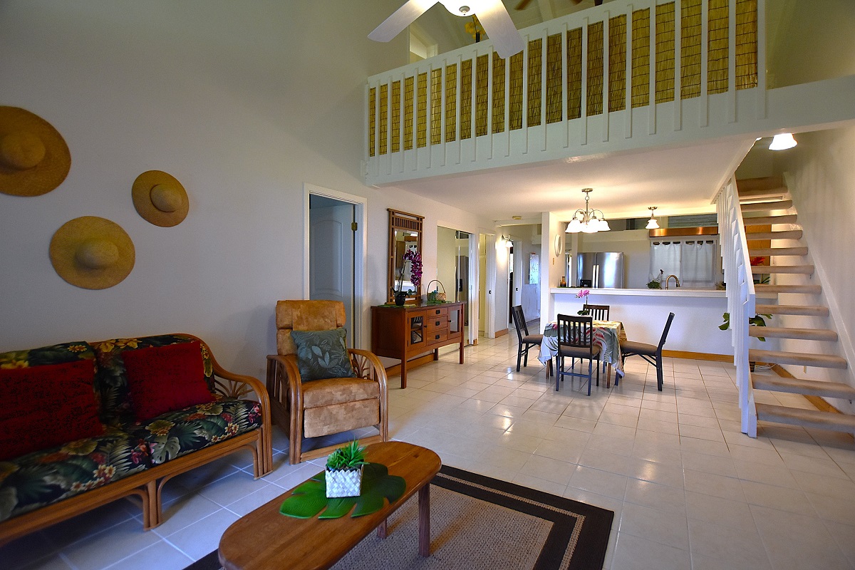 68-3840 Lua Kula Street, Unit D203 Waikoloa, HI 96738 - Photo 4 of 30 a living room with furniture a rug and a window