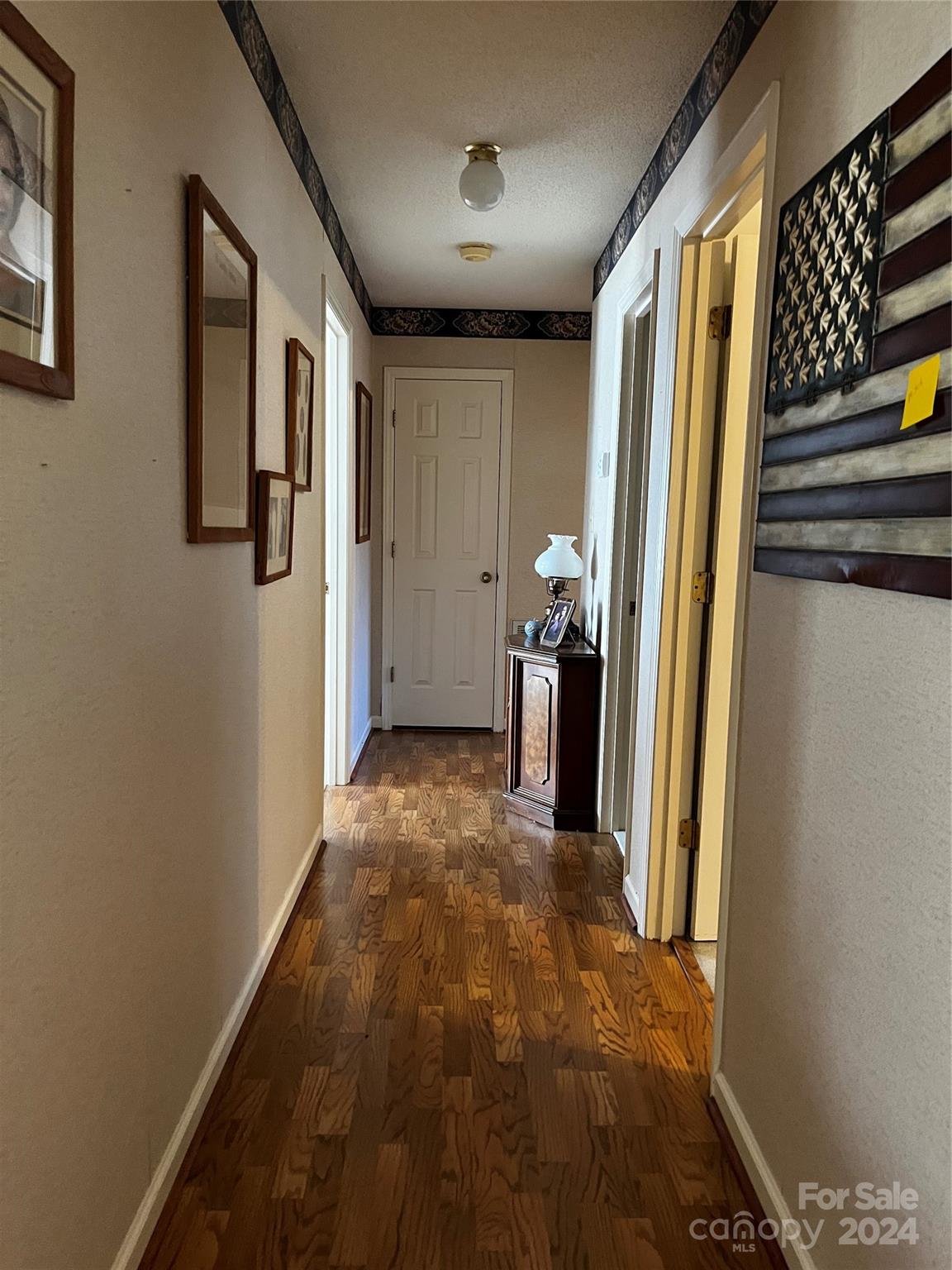 2239 Tryon Courthouse Road Bessemer City, NC 28016 - Photo 16 of 26 a view of a hallway with wooden walls and stair