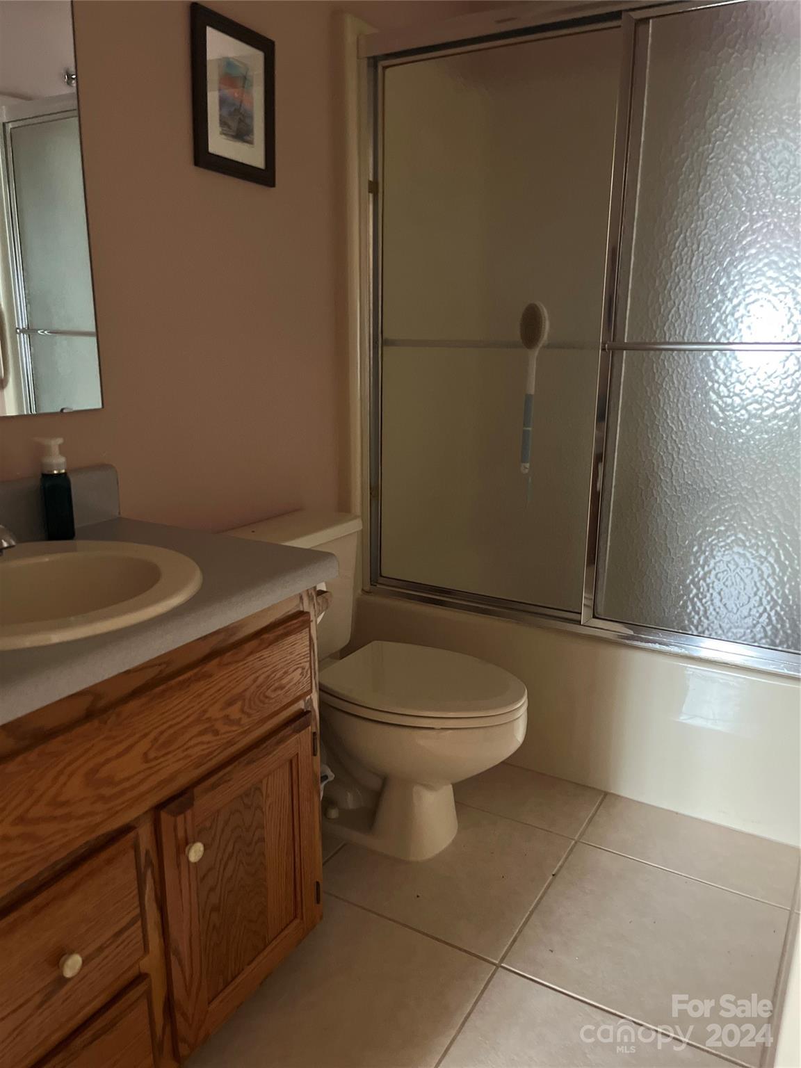 2239 Tryon Courthouse Road Bessemer City, NC 28016 - Photo 17 of 26 a bathroom with a toilet a sink and shower