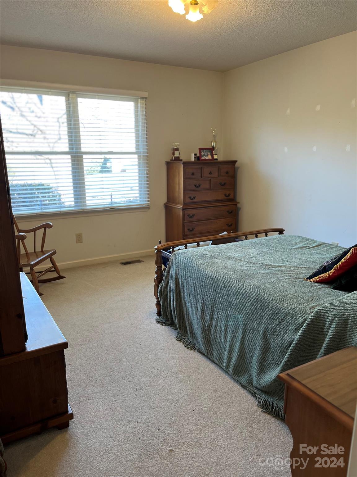 2239 Tryon Courthouse Road Bessemer City, NC 28016 - Photo 18 of 26 a bedroom with a bed and a window