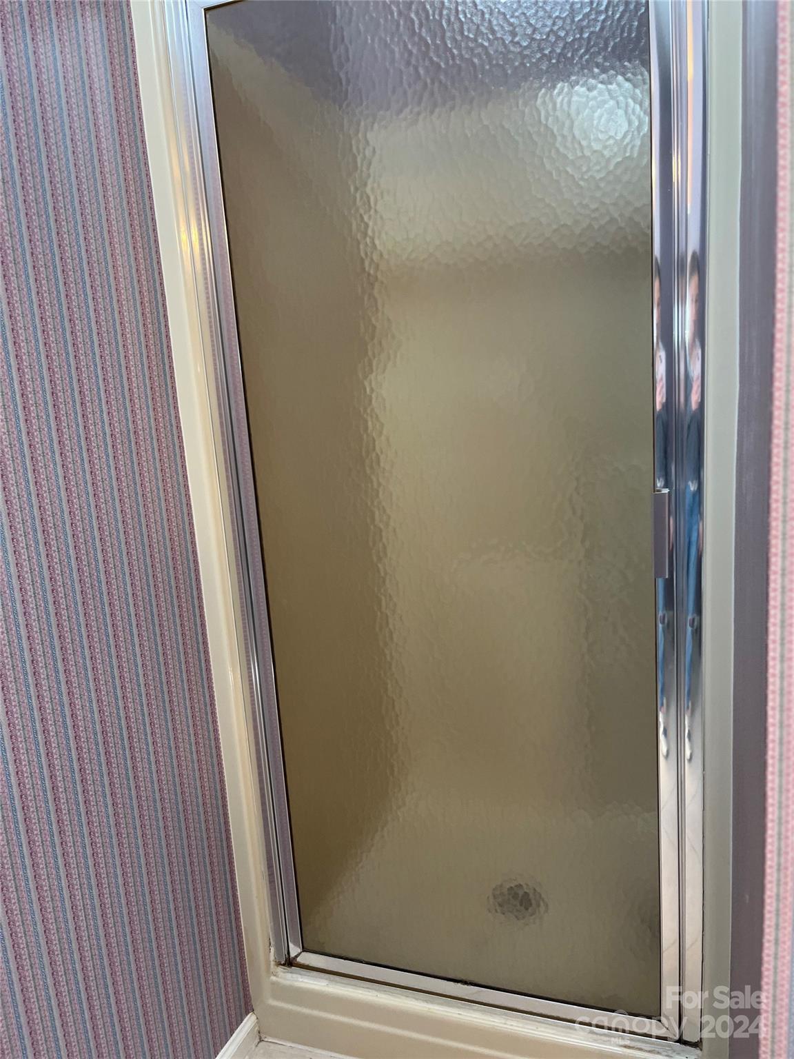 2239 Tryon Courthouse Road Bessemer City, NC 28016 - Photo 23 of 26 a bathroom with a glass door