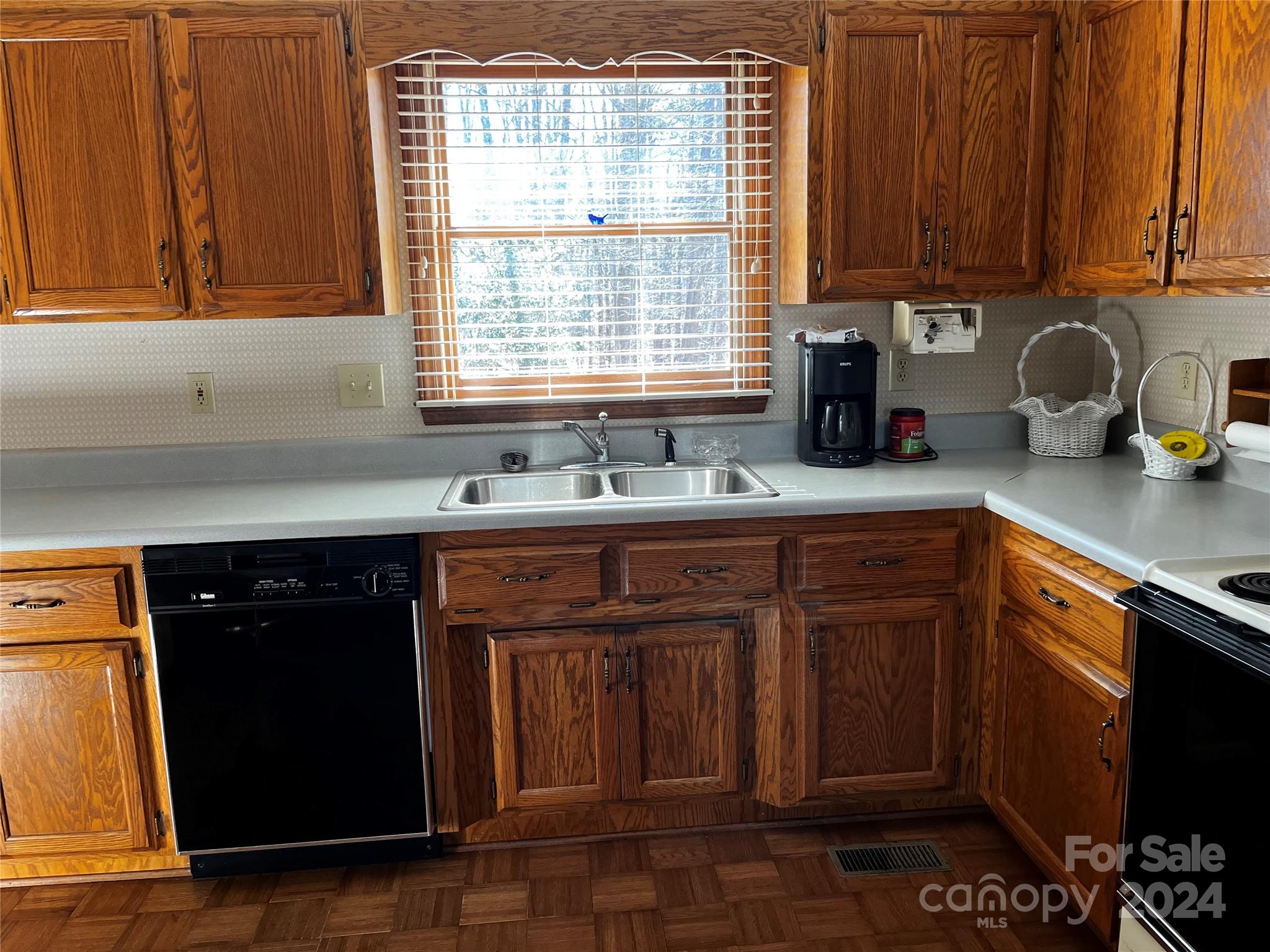 2239 Tryon Courthouse Road Bessemer City, NC 28016 - Photo 7 of 26 a kitchen with a sink cabinets and window