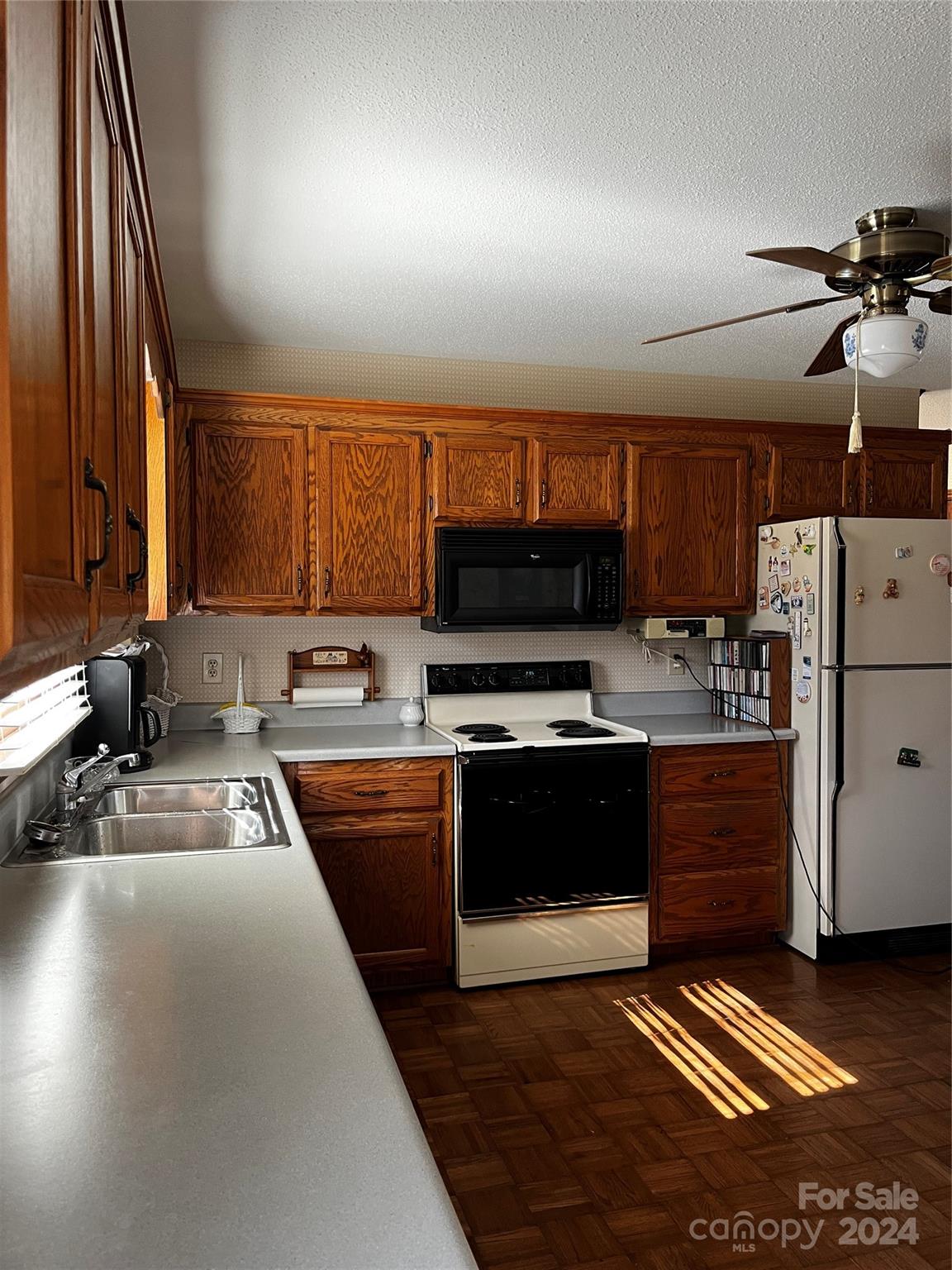 2239 Tryon Courthouse Road Bessemer City, NC 28016 - Photo 8 of 26 a kitchen with stainless steel appliances granite countertop a stove a sink and a microwave