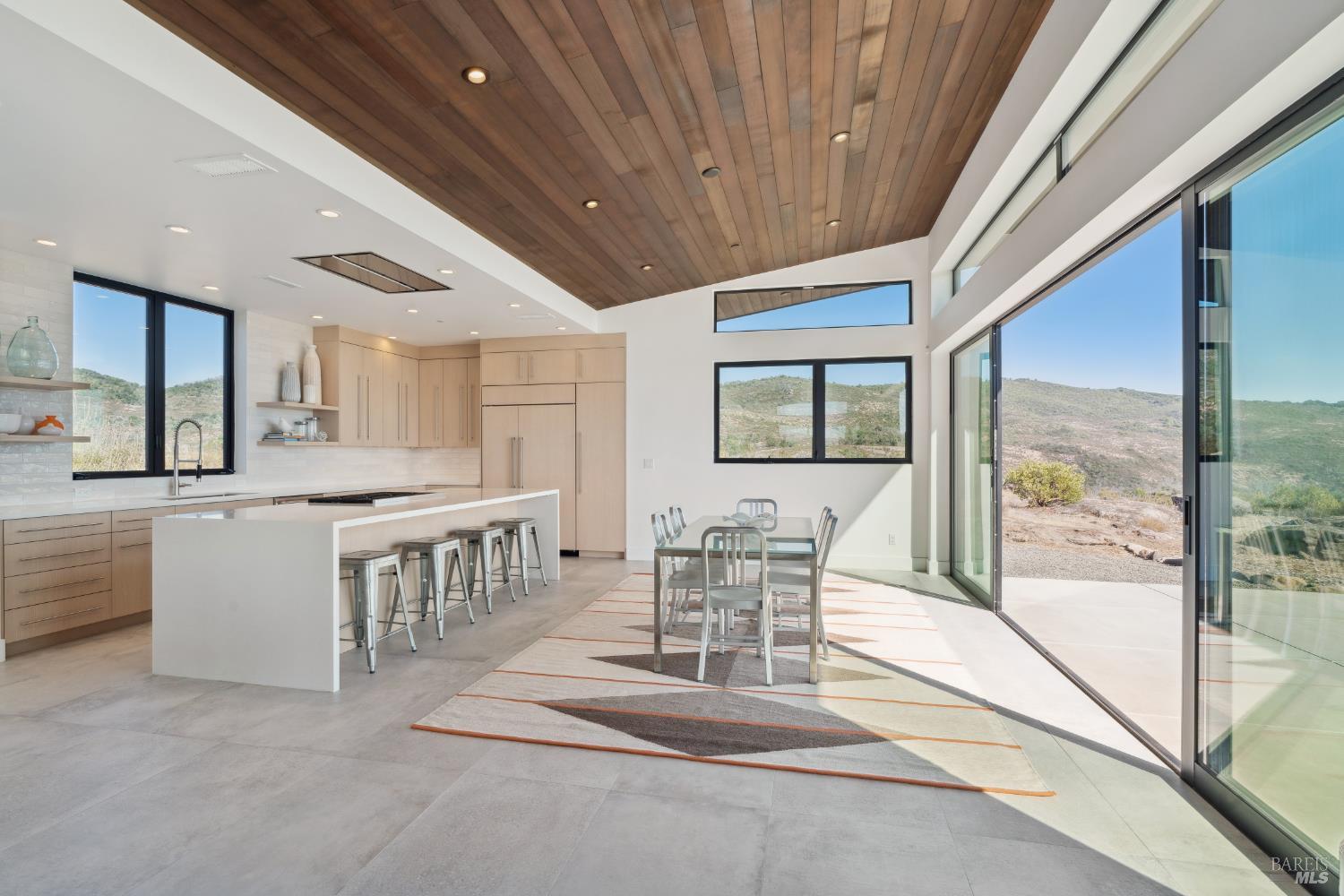 3400 Atlas Peak Road Napa, CA 94558 - Photo 12 of 34 a view of a dining room with furniture window and wooden floor