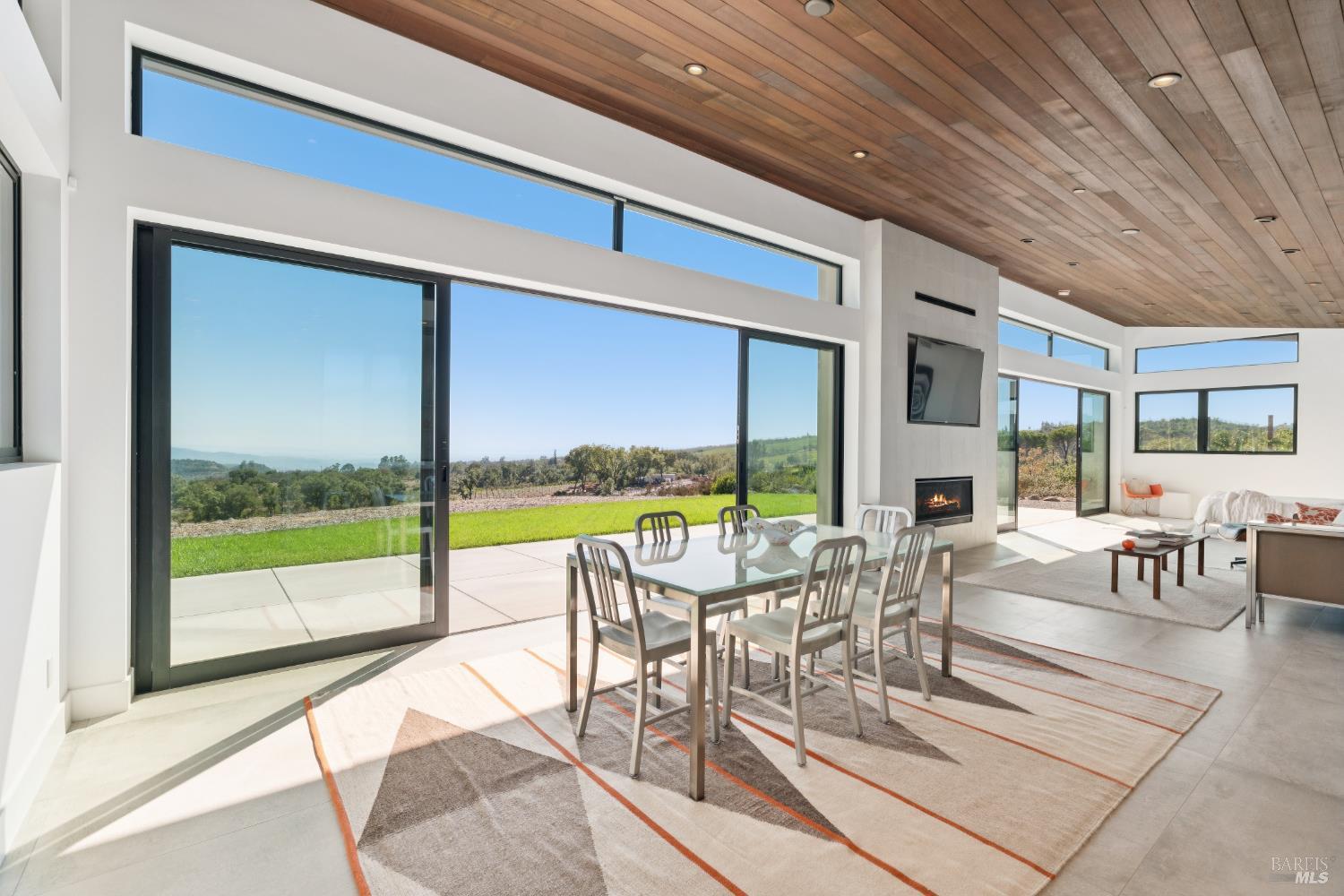 3400 Atlas Peak Road Napa, CA 94558 - Photo 14 of 34 a living room with furniture and a floor to ceiling window