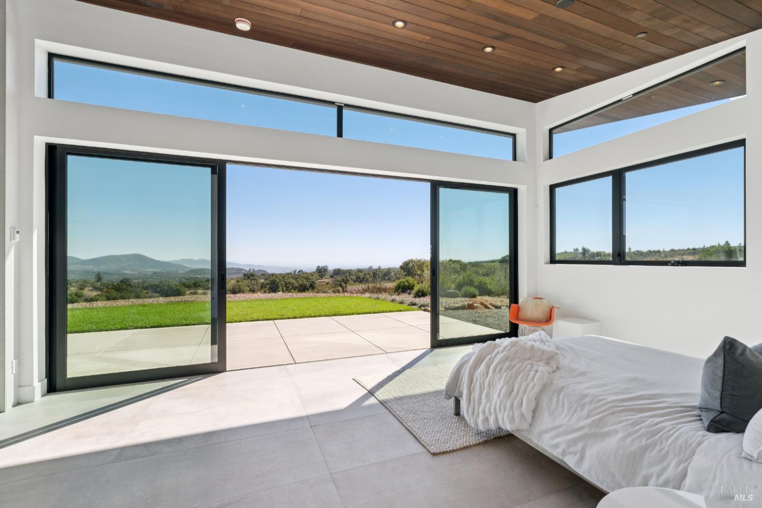 3400 Atlas Peak Road Napa, CA 94558 - Photo 16 of 34 a bed sitting in a bedroom next to a window