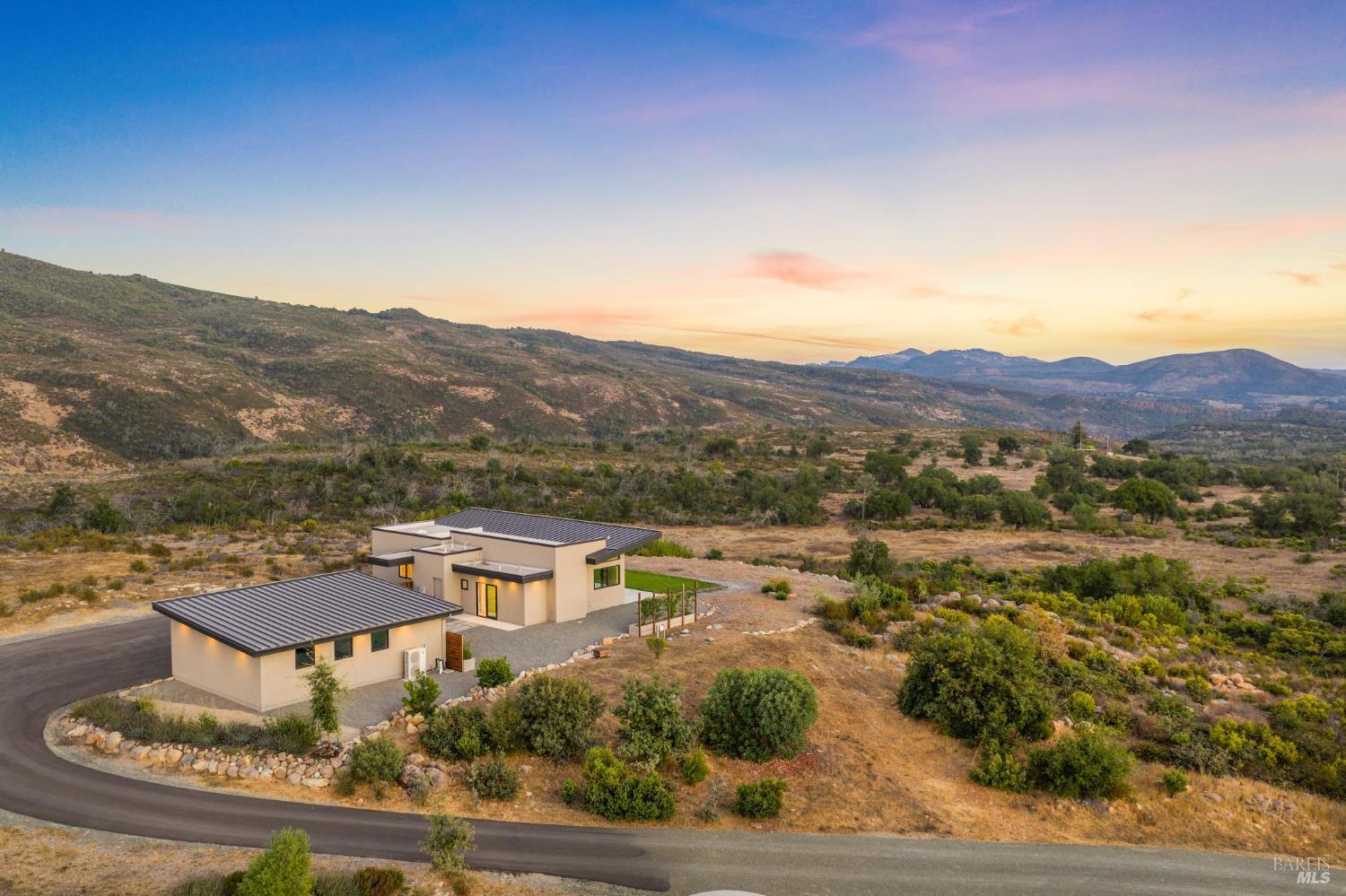 3400 Atlas Peak Road Napa, CA 94558 - Photo 31 of 34 a view of a house with a mountain in the background