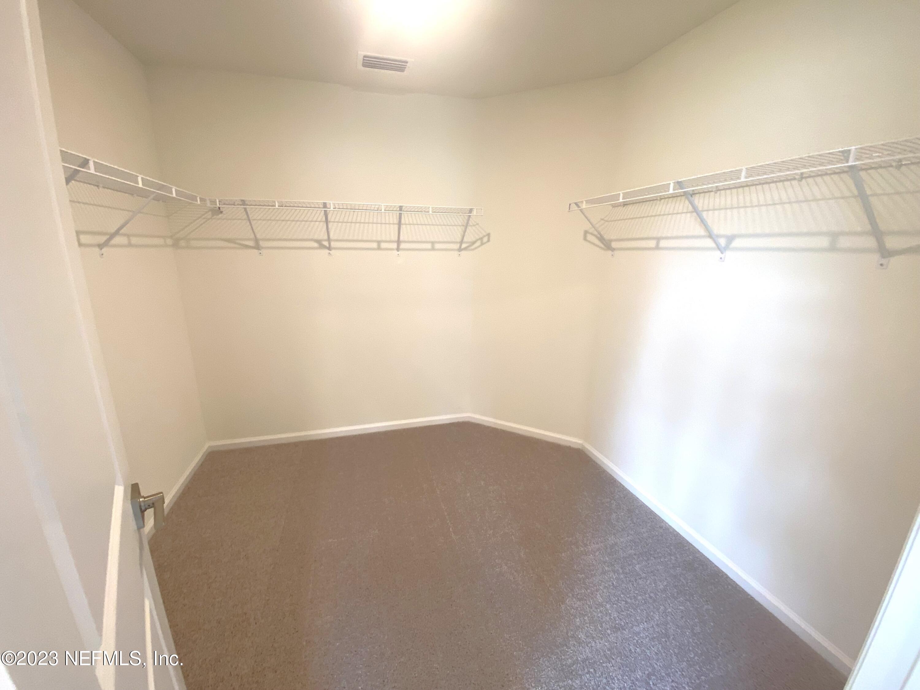 7930 Rippa Valley Way Jacksonville, FL 32222 - Photo 7 of 19 15- primary bedroom closet