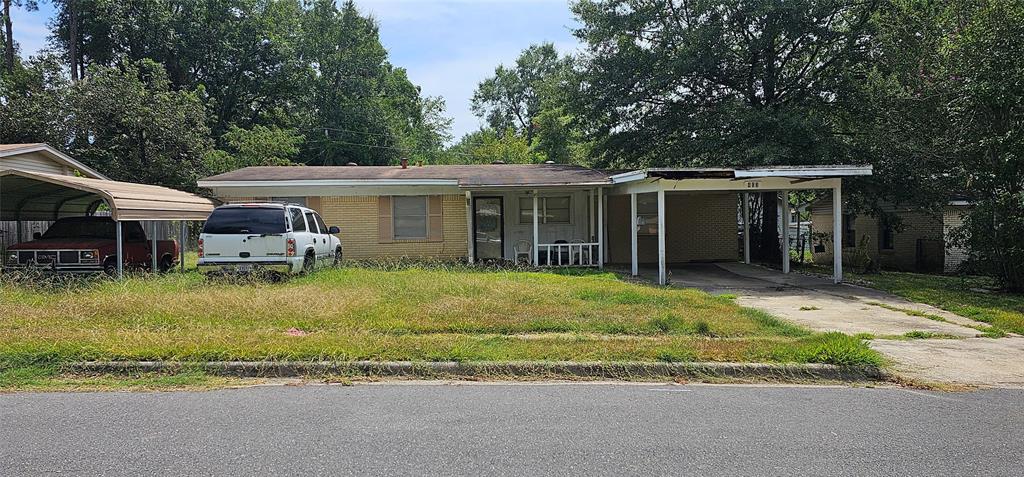 403 North Park Drive Springhill, LA 71075 - Photo 1 of 31 a view of a house with a yard patio and a garden