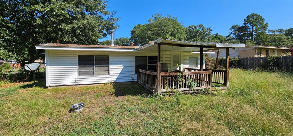 403 North Park Drive Springhill, LA 71075 - Photo 23 of 31 a view of a chair and table in backyard of the house