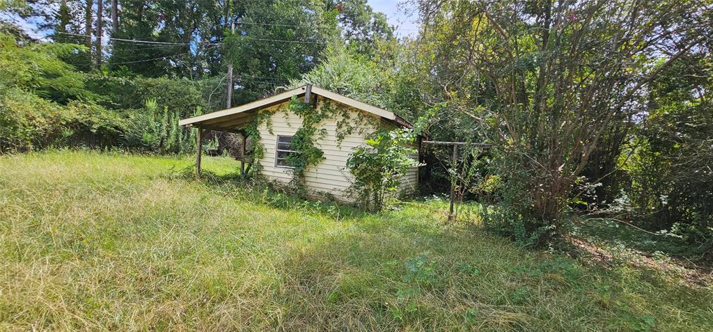 403 North Park Drive Springhill, LA 71075 - Photo 29 of 31 a view of a wooden house with a yard