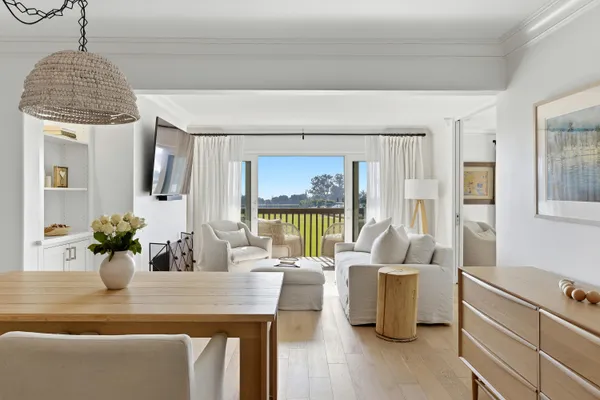 a view of a living room and dining room