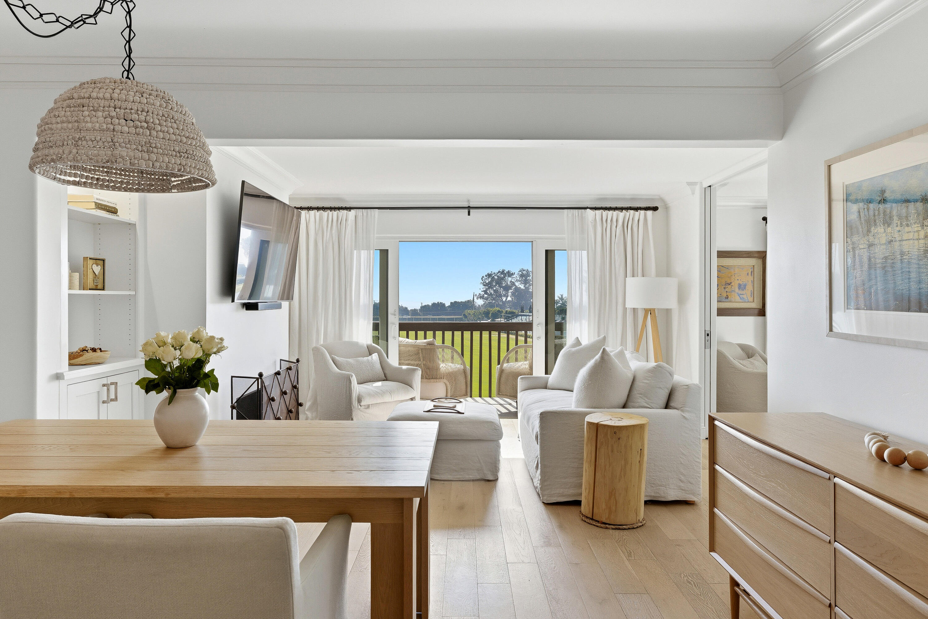 a view of a living room and dining room
