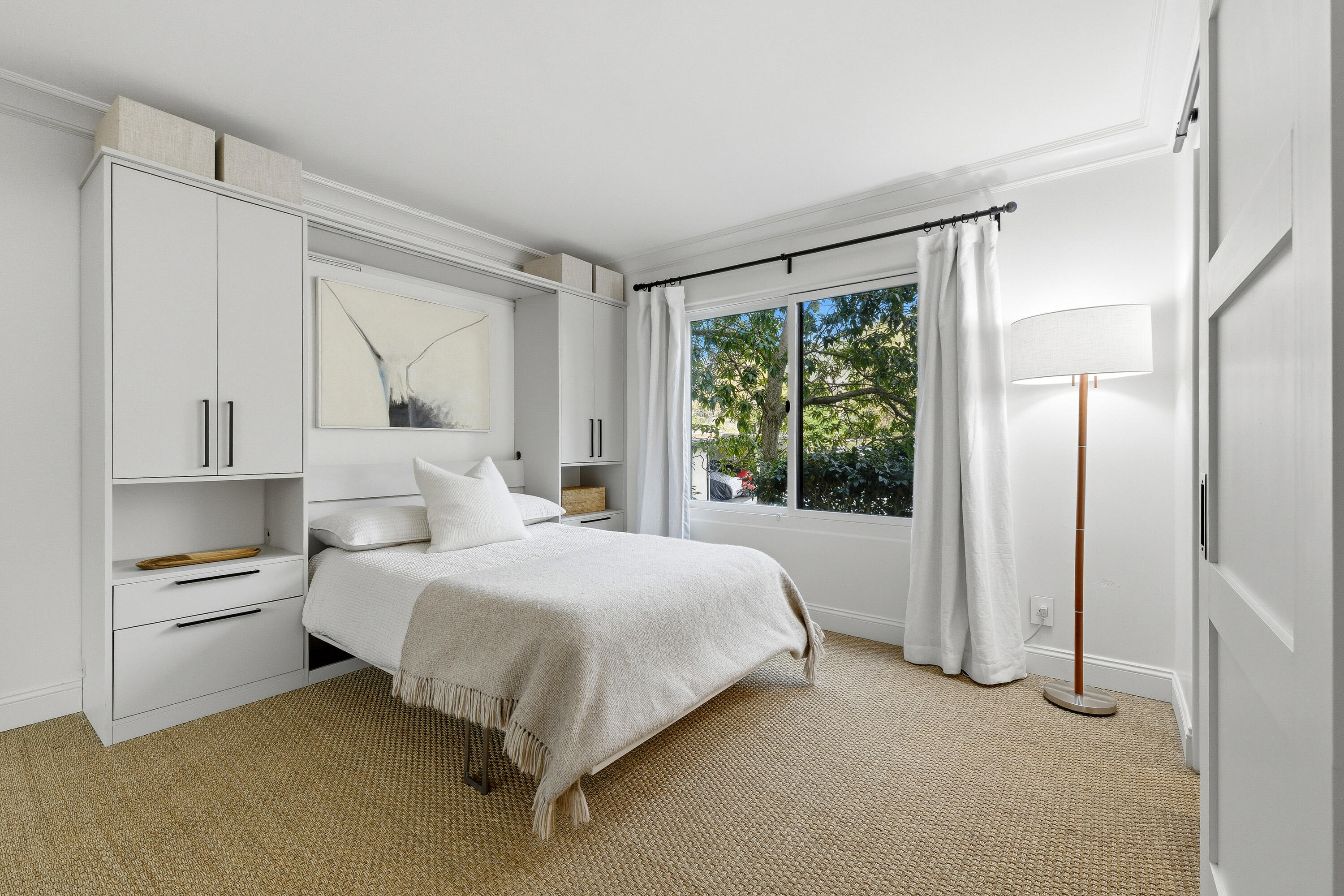 3375 Foothill Road, Unit 923 Carpinteria, CA 93013 - Photo 13 of 23 a bedroom with a bed and a large window