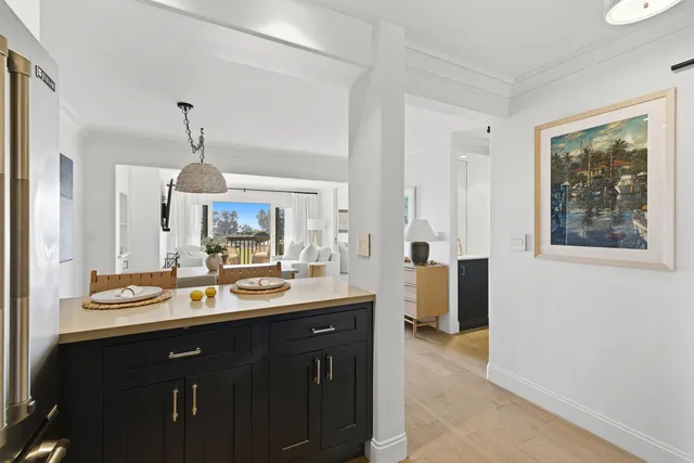 a kitchen with a sink and a refrigerator