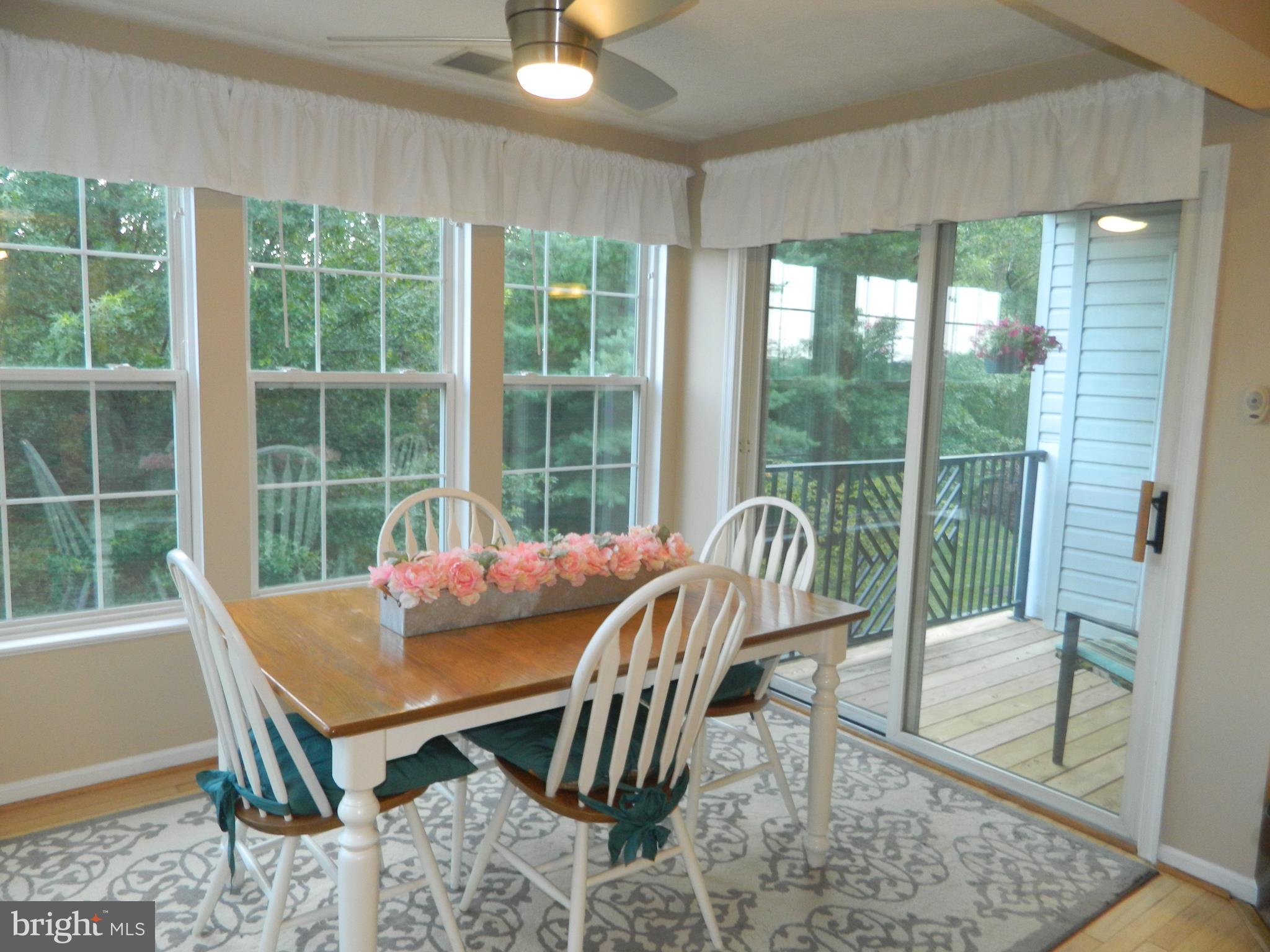 8253 Poplar Mill Road, Unit 8253 Baltimore, MD 21236 - Photo 12 of 34 Remote control ceiling fan & sliders to balcony