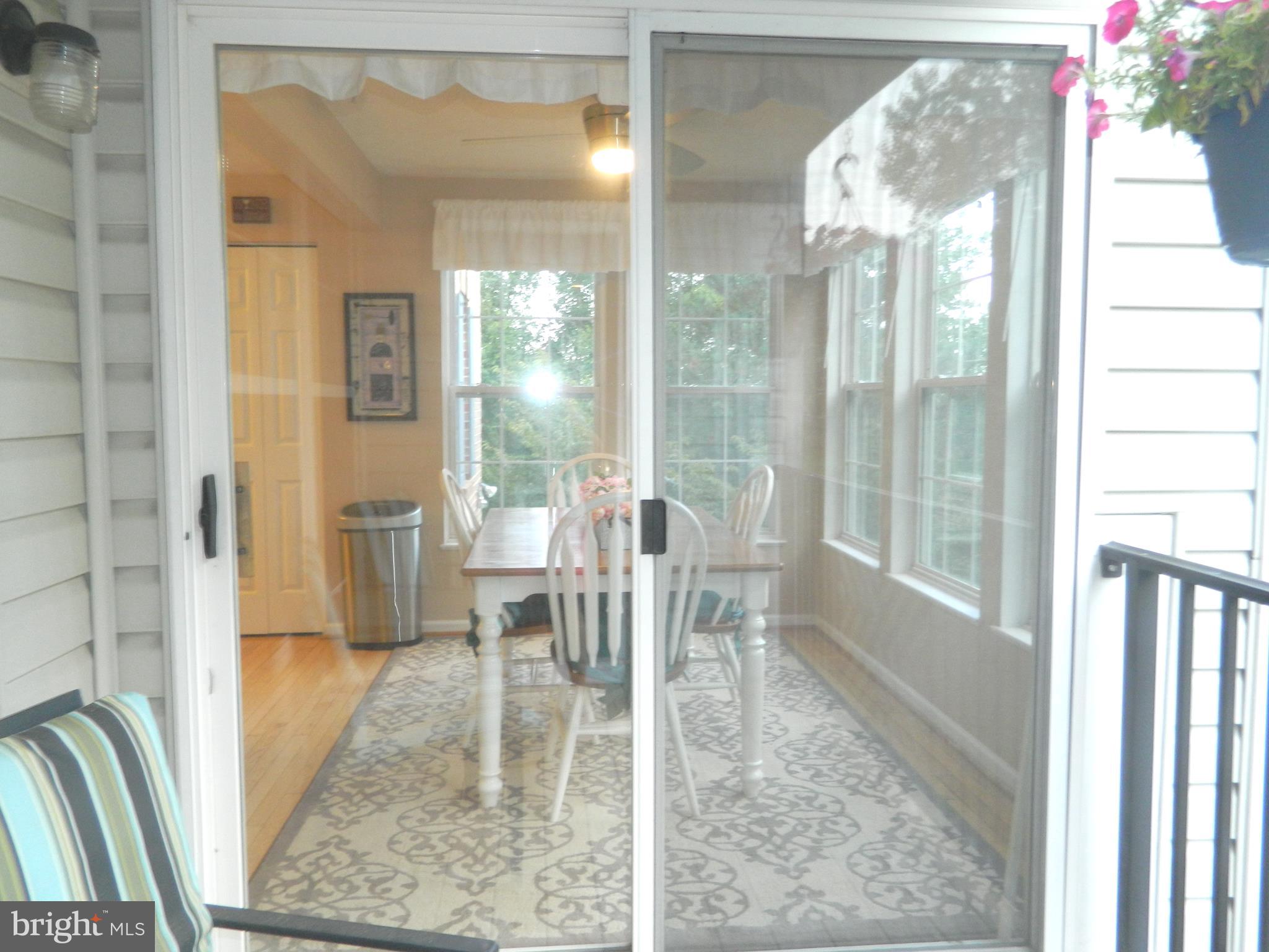 8253 Poplar Mill Road, Unit 8253 Baltimore, MD 21236 - Photo 14 of 34 A view from the balcony porch to the dining area