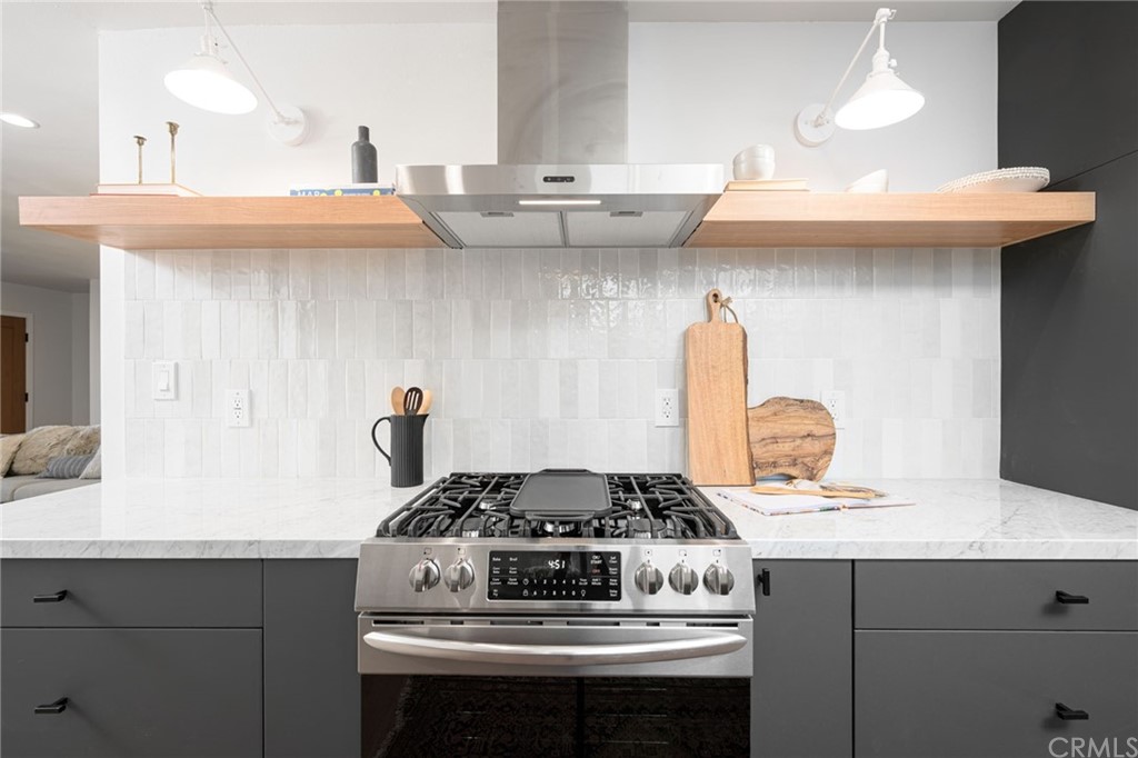 5418 Sanchez Drive Los Angeles, CA 90008 - Photo 12 of 28 a stove top oven sitting inside of a kitchen