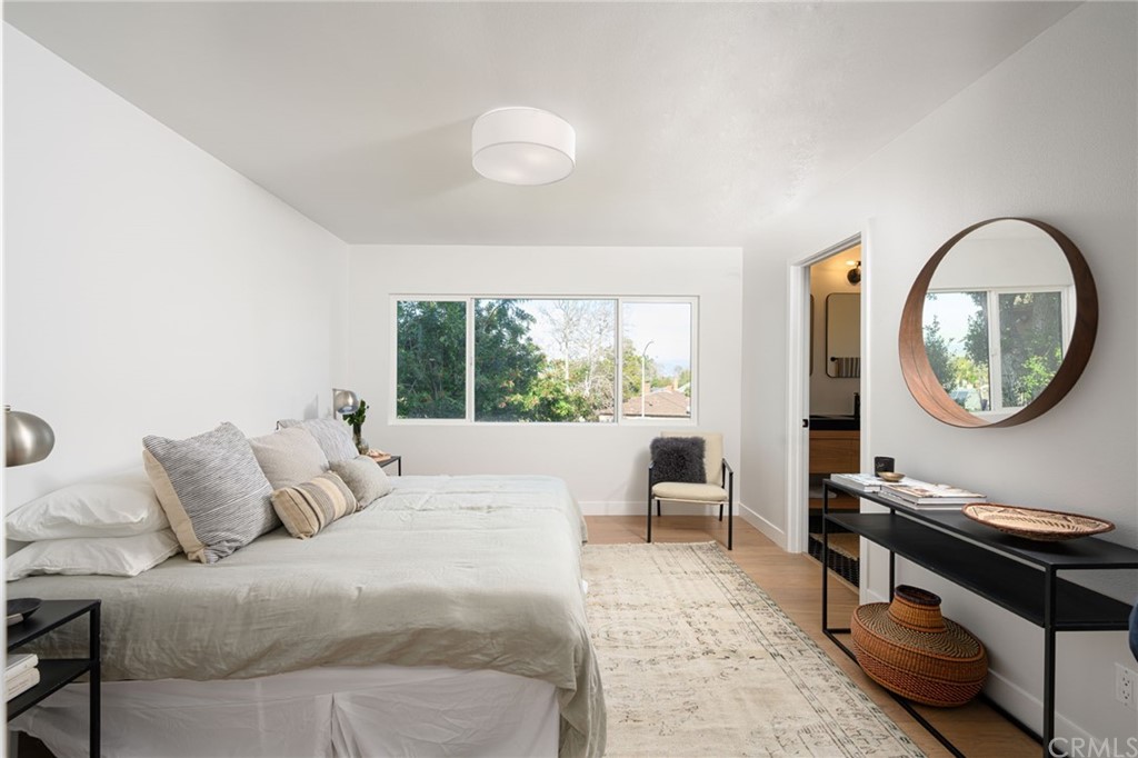 5418 Sanchez Drive Los Angeles, CA 90008 - Photo 16 of 28 a living room with furniture a rug and a large window