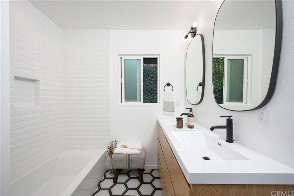 5418 Sanchez Drive Los Angeles, CA 90008 - Photo 21 of 28 a bathroom with a sink and a mirror