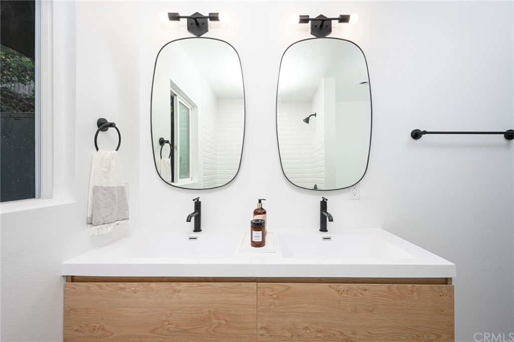 5418 Sanchez Drive Los Angeles, CA 90008 - Photo 22 of 28 a bathroom with a sink and mirror