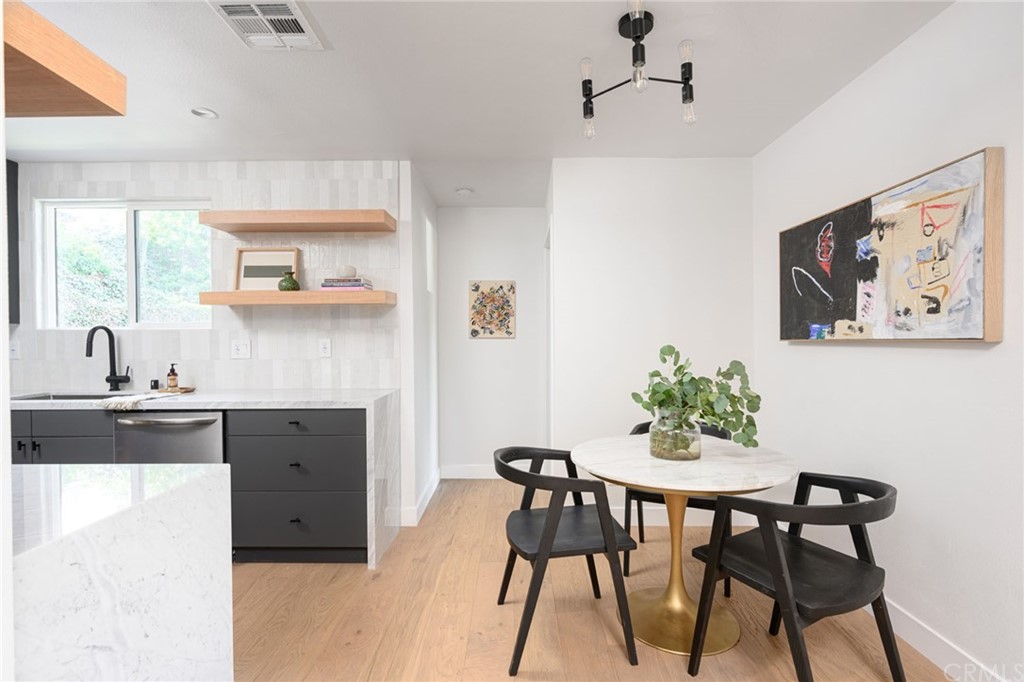 5418 Sanchez Drive Los Angeles, CA 90008 - Photo 9 of 28 a kitchen with a table and chairs in it