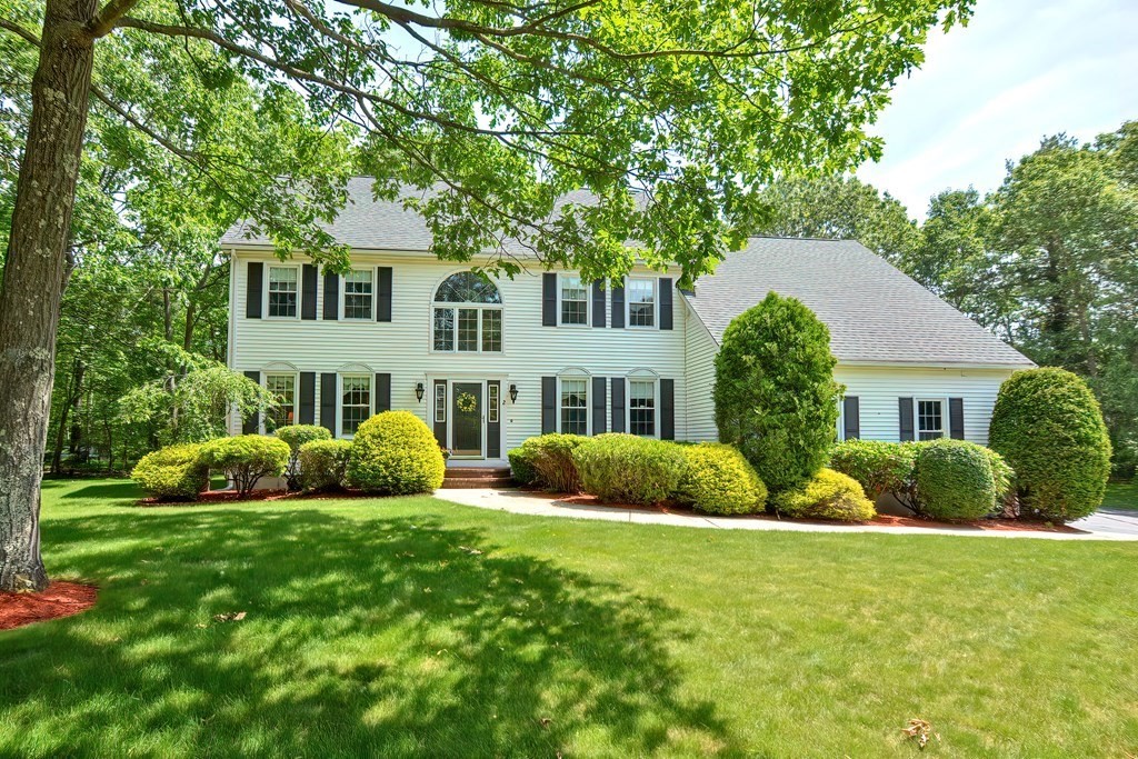 2 Harrison Place Franklin, MA 02038 - Photo 1 of 34 a front view of a house with a garden and plants
